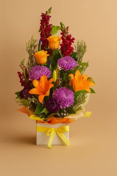 Bright flower arrangement Gold Coast with colourful seasonal flowers in container