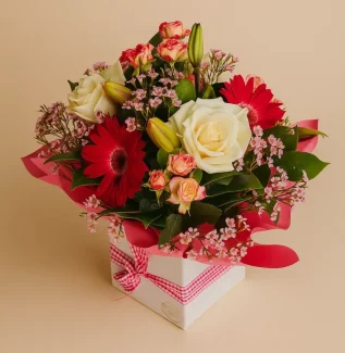 Flower box arrangement Gold Coast with roses lilies and mixed flowers in a decorative gift box