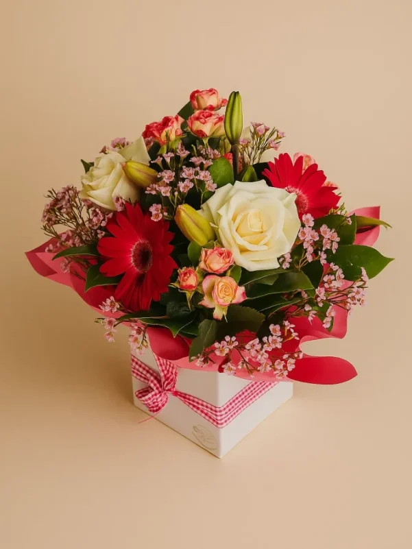 Flower box arrangement Gold Coast with roses lilies and mixed flowers in a decorative gift box