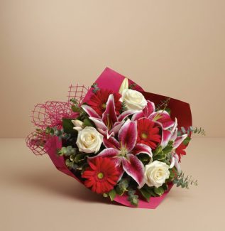 Bouquet with lilies gerberas and roses Gold Coast in elegant seasonal arrangement