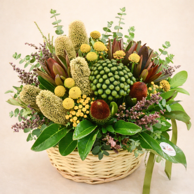 Australian native flower basket arrangement with banksia, billy buttons and eucalyptus in a woven basket Gold Coast