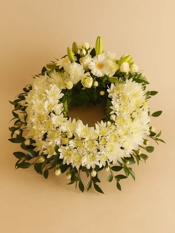 White funeral wreath Gold Coast with white flowers arranged in a circular sympathy tribute