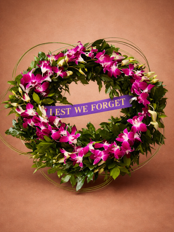 Lest We Forget funeral wreath with pink orchids and greenery Gold Coa