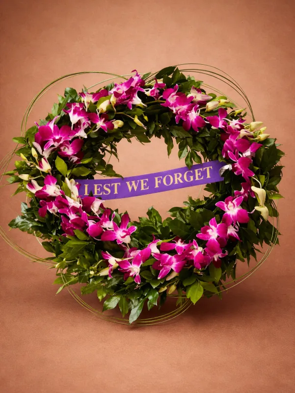 Lest We Forget funeral wreath with pink orchids and greenery Gold Coa