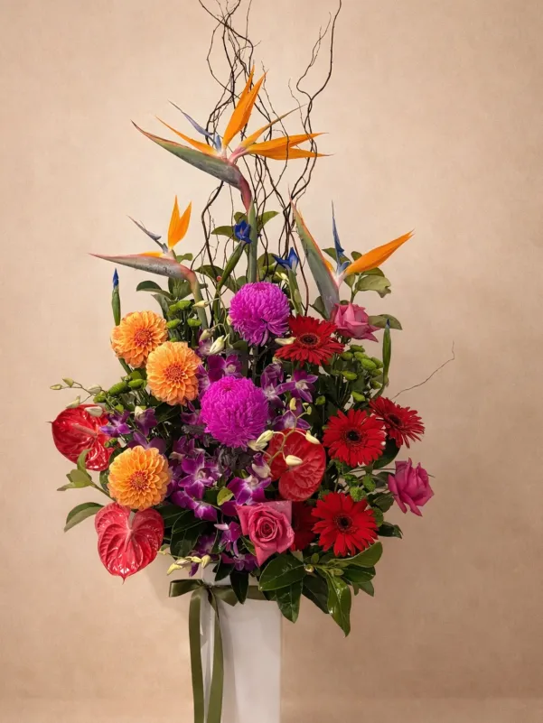 Tropical flower arrangement with exotic blooms and greenery in modern style Gold Coast