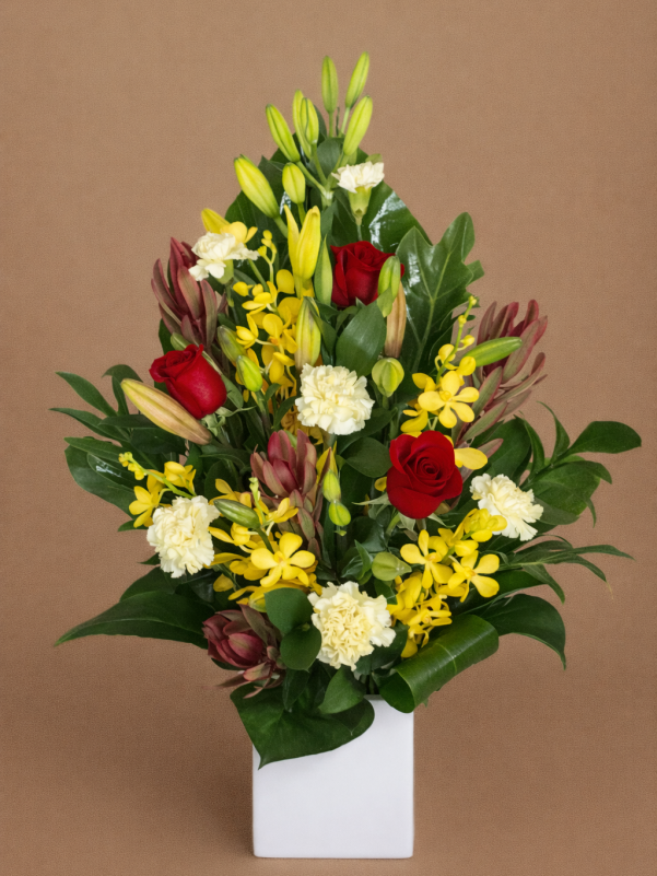 Diano flower arrangement with red roses yellow orchids lilies in ceramic vase Gold Coast