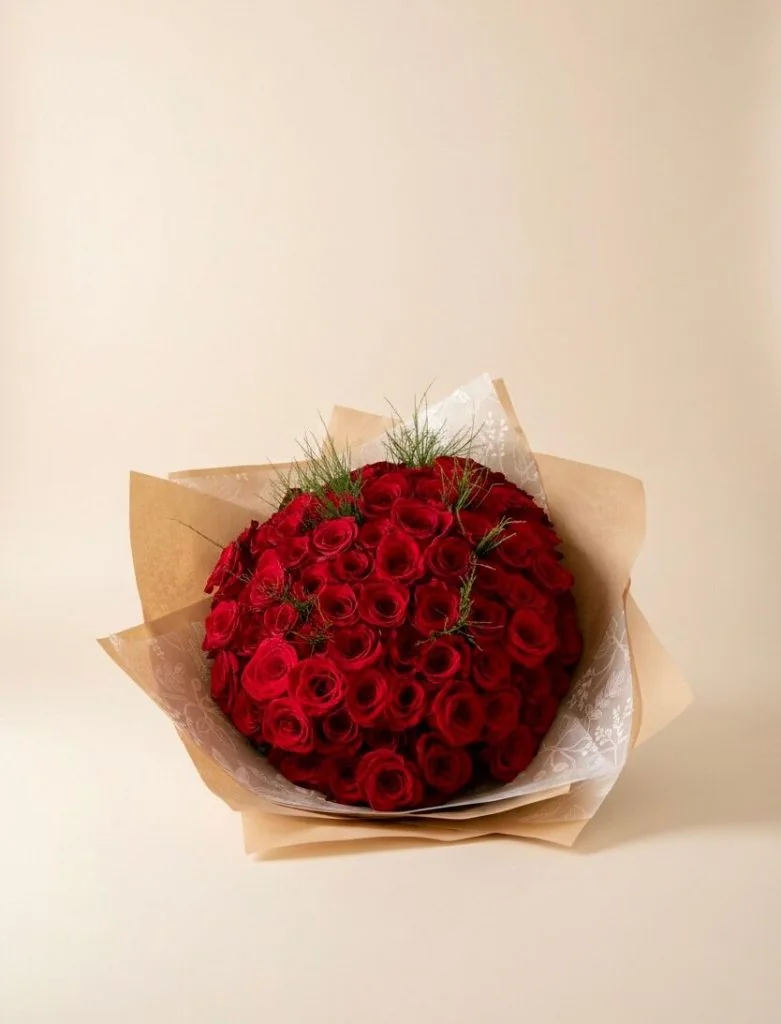 100 rose bouquet Gold Coast with premium fresh roses arranged in a large round bouquet, available in red or pink