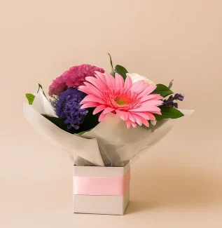 Small seasonal flower arrangement in a box with fresh mixed blooms, perfect for gifting on the Gold Coast