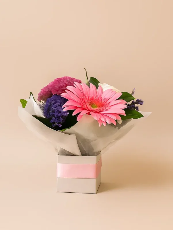 Small seasonal flower arrangement in a box with fresh mixed blooms, perfect for gifting on the Gold Coast