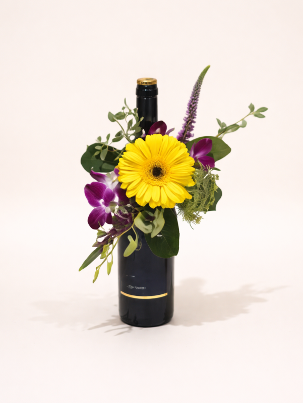 Flower arrangement with wine Gold Coast featuring fresh seasonal flowers and a bottle gift