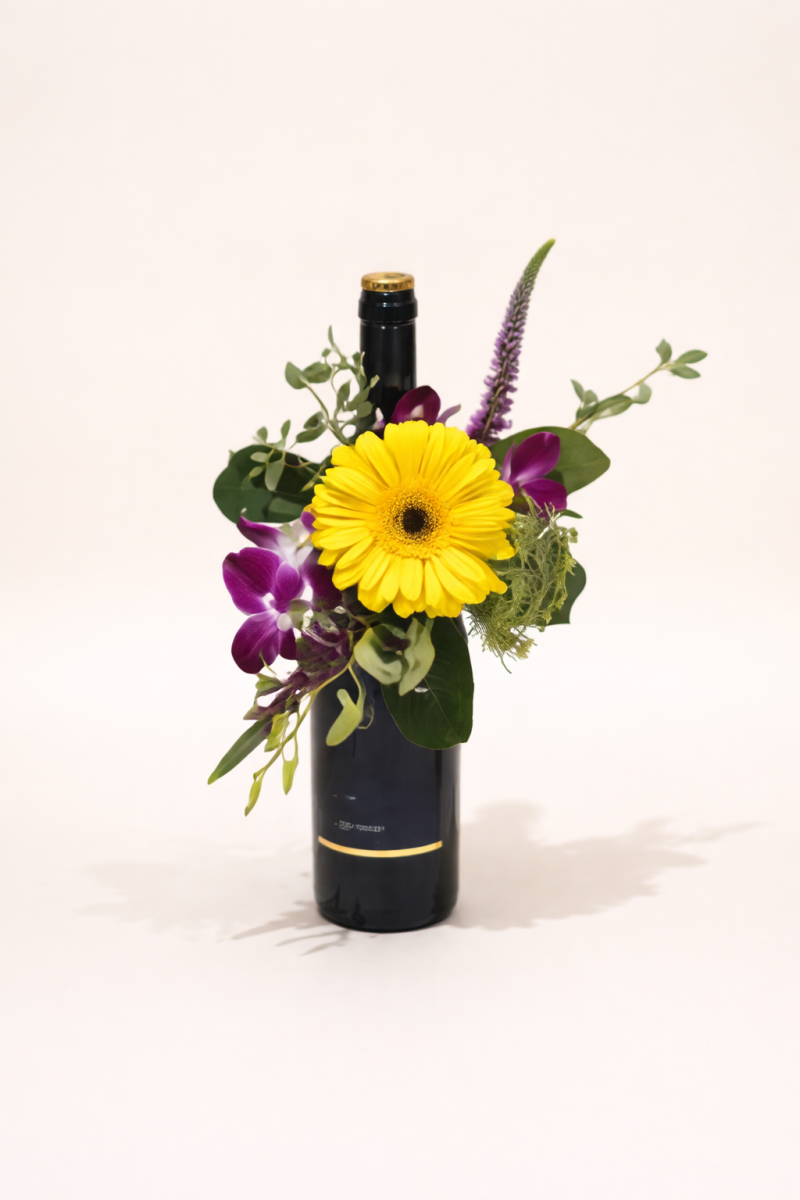 Flower arrangement with wine Gold Coast featuring fresh seasonal flowers and a bottle gift