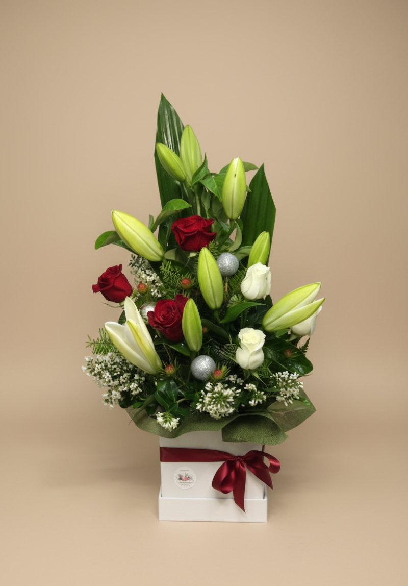 Custom Christmas flower arrangement in festive boxed style – florist’s choice by Flowers of Southport