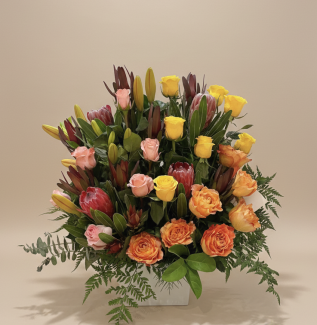 Luxury flower arrangement with yellow, peach and pink roses, proteas and lilies in a grand premium design – Flowers of Southport