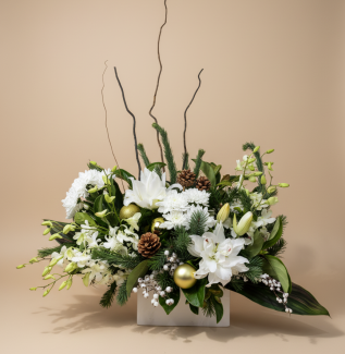 Elegant white Christmas flower arrangement with lilies, orchids, evergreens, pinecones and gold accents – Flowers of Southport