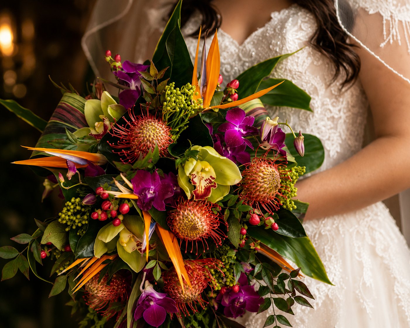 Bridal bouquet of pincushion proteas, cymbidium orchids and birds of paradise — Gold Coast wedding florist, Mount Tamborine