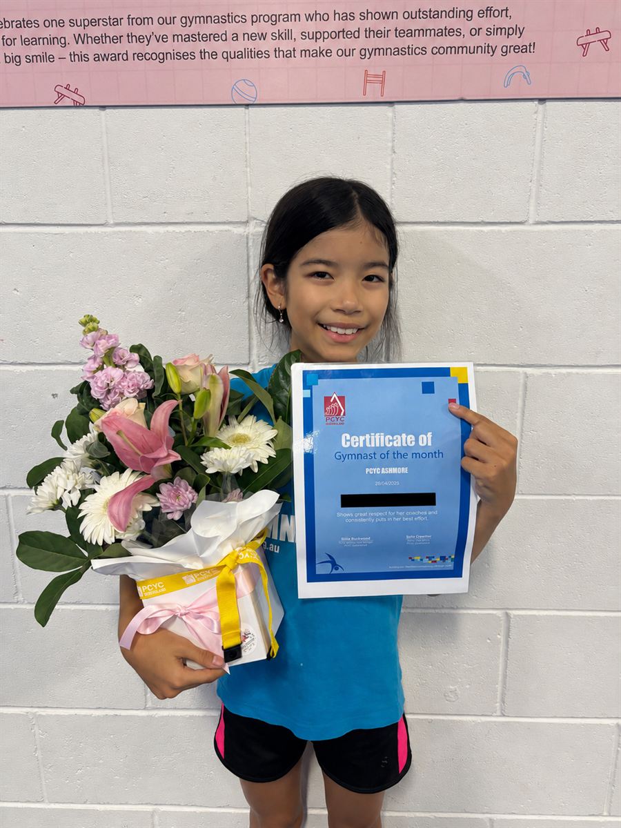 Olivia, PCYC Ashmore April Gymnast of the Month, holding her certificate and the Flowers of Southport bouquet she received.