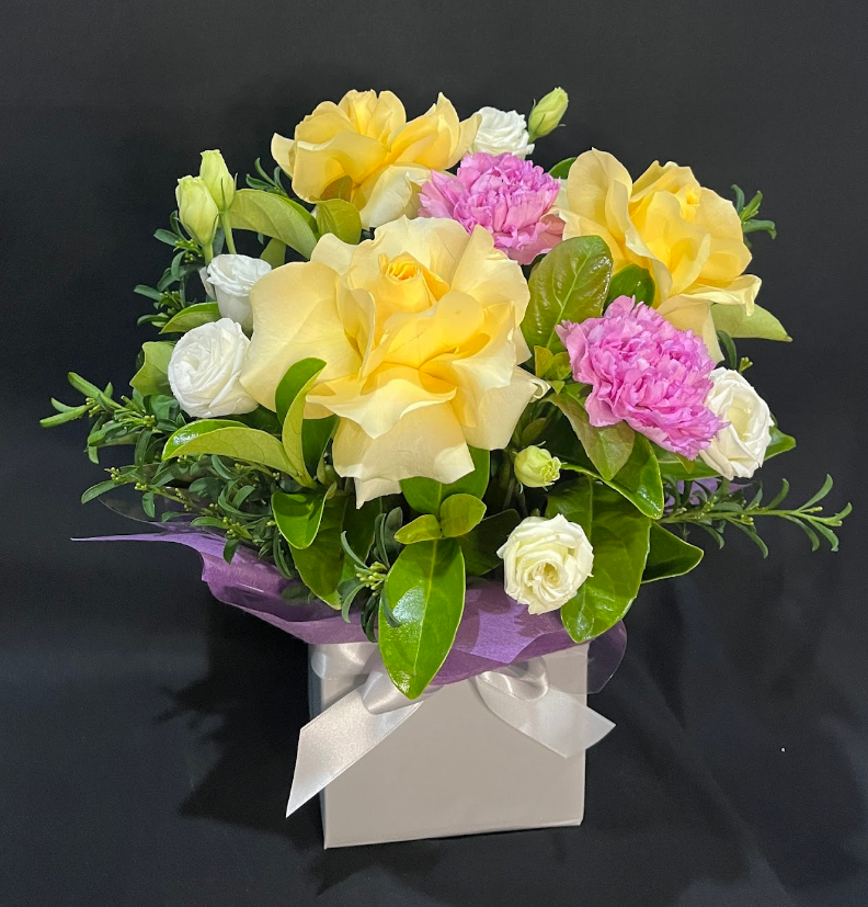 yellow and purple arrangement with reflexed roses